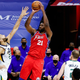 Rudy Gobert tries, and fails, to stop Joel Embiid from getting a shot off.
